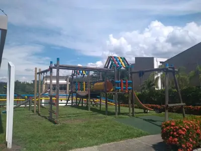 a playground in a park with a slide at cabaña en san jeromino in San Jerónimo
