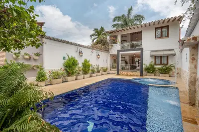 an exterior view of a house with a swimming pool at Casa Bixa Hotel Boutique -Santa Fe de Antioquia- Mayores de 12 años in Santa Fe de Antioquia