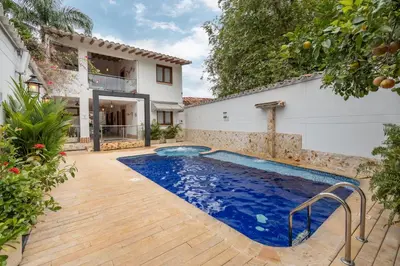 a swimming pool in the backyard of a house at Casa Bixa Hotel Boutique -Santa Fe de Antioquia- Mayores de 12 años in Santa Fe de Antioquia