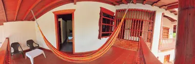 a room with a large rope around a house at La Casa de las Flores Hostal in Jardin