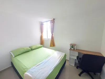 a bedroom with a bed and a desk and a chair at Apartamento Boston - Downtown - 2 hab - Wifi in Medellín