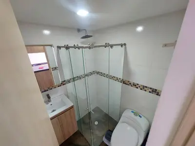 a bathroom with a shower and a toilet and a sink at Apartamento Boston - Downtown - 2 hab - Wifi in Medellín
