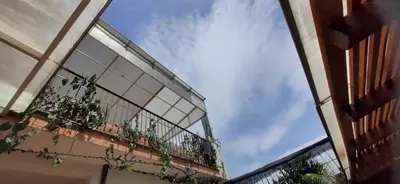 a balcony with plants on the side of a building at Villa del Prado in Medellín