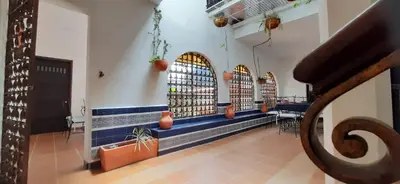 a room with a row of windows in a building at Villa del Prado in Medellín