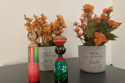 three vases with flowers in them on a table at Charming apartment in downtown – Home ARIS 301 in Medellín