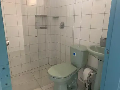 a bathroom with a toilet and a sink at Charming apartment in downtown – Home ARIS 301 in Medellín