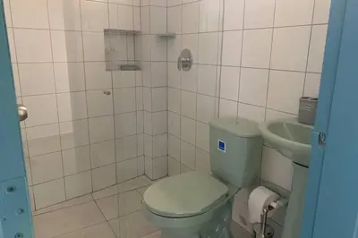 a bathroom with a toilet and a sink at Charming apartment in downtown – Home ARIS 301 in Medellín