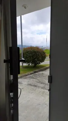 an open door with a view of a road at Apartamento-Habitación Palonegro Manizales in Manizales