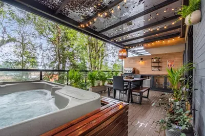 a hot tub in the middle of a patio at Olive Living Suites by HOUSY in Envigado