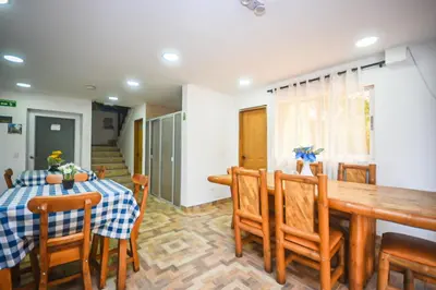 a dining room with a table and chairs at Finca Hotel Zona Franca in Rionegro