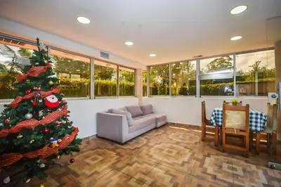 a living room with a christmas tree and a couch at Finca Hotel Zona Franca in Rionegro