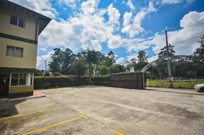 a parking lot in front of a building at Finca Hotel Zona Franca in Rionegro