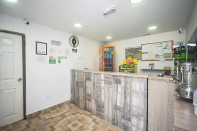 a restaurant with a counter in a room at Finca Hotel Zona Franca in Rionegro