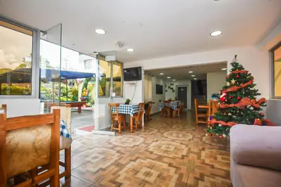 a christmas tree in the dining room of a restaurant at Finca Hotel Zona Franca in Rionegro