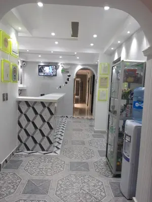 a store with a lobby with a counter and a hallway at Hotel El Deportista in Medellín