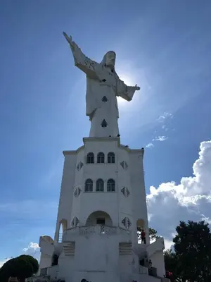 a statue of christ the redeemer on top of a building at Hotel San Felipe Belalcazar in Belcazar Caldas