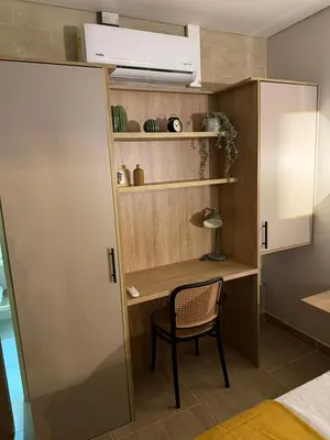 a room with a desk and a chair at Manila Hotel Boutique in Medellín