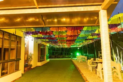 a building with a bunch of umbrellas hanging from the ceiling at Hotel Bahia Del Faro in Guatapé