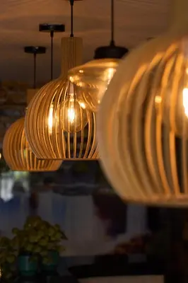 a group of plates hanging from a ceiling at Kamaleb Farallones Hotel in Quibdó