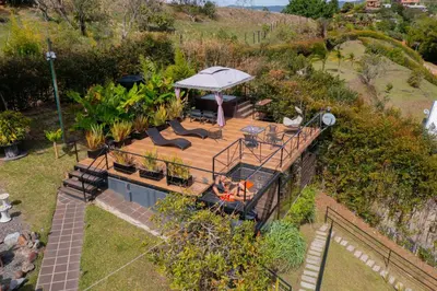 an aerial view of a house with a deck at Glamping Montecarlo Lodge Cubo de Madera-Guatapé in Guatapé
