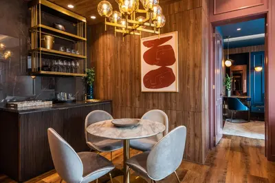 a dining room with a table and chairs at Hotel Marquee Medellín in Medellín