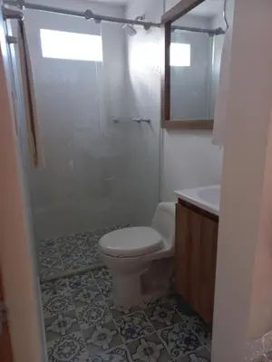 a bathroom with a toilet and a shower and a sink at Apartamento FL Martinz in Manizales