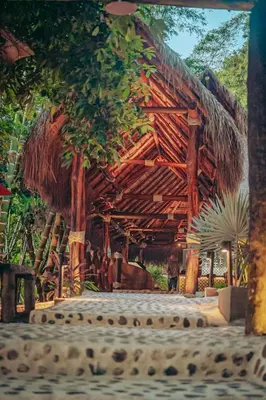 a painting of a wooden building with a roof at Refugio Monte Oscuro in Las Mercedes