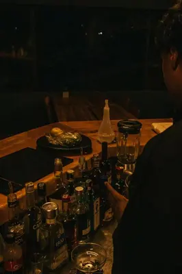 a table with a bunch of bottles and glasses on it at Soy Local Guatape Campestre in Guatapé