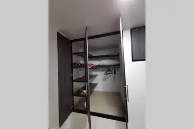 a room with a closet with a ladder in it at Hermoso y cómodo apartamento in San Rafael