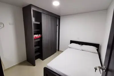 a small bedroom with a bed and a closet at Hermoso y cómodo apartamento in San Rafael