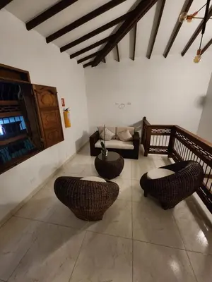a living room with two chairs and a couch at Casa Isabel Hotel in Jardin