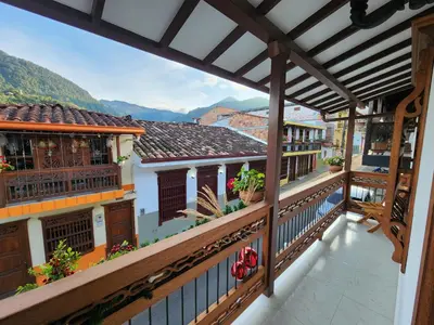 a balcony with a view of the mountains at Casa Isabel Hotel in Jardin