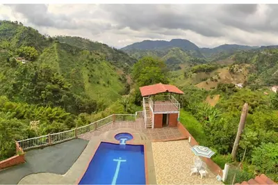 an aerial view of a house with a swimming pool at Apartamento campestre in Manizales