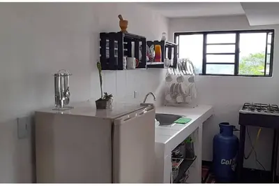 a white kitchen with a refrigerator and a sink at Apartamento campestre in Manizales