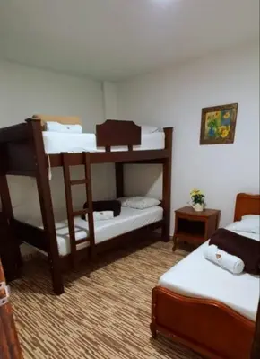 a room with two bunk beds in a room at YoamoJardin ... es como estar en casa in Jardin