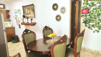 a dining room with a table and chairs at YoamoJardin ... es como estar en casa in Jardin