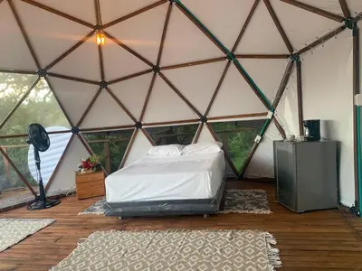 a room with a bed in a tent at Eco-Glamping Shalom in Mariquita