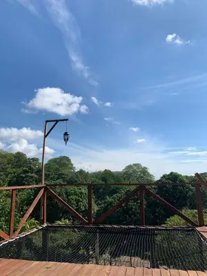 a bridge with a street light on top of it at Eco-Glamping Shalom in Mariquita