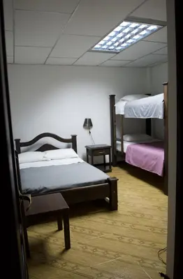 a bedroom with two bunk beds and a skylight at Hospedaje Casa Real in Salamina