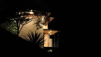 a building at night with a light on it at Palagua Lodge in San Rafael