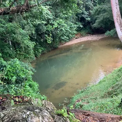 a pool of water in the middle of a river at Paraíso Escondido Cabañas, Reserva Rio Claro, San Luis-Doradal in San Luis