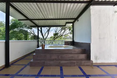 a bathroom with a tub and stairs in a building at CABAÑAS LA DORADA in Doradal