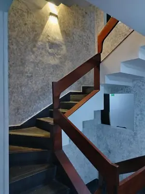 a staircase in a house with a light on it at Hotel Country Medellin in Medellín