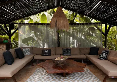a living room with a couch and a table at Hotel Casa Candela in San Jerónimo