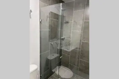 a bathroom with a shower with a toilet at Hermoso Apartaestudio en Sabaneta. in Sabaneta