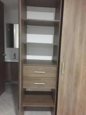 a wooden cabinet with two drawers and a sink at Hermoso Apartaestudio en Sabaneta. in Sabaneta