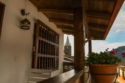 a balcony with a window with a view of a building at La Casa de Ana in Jardin