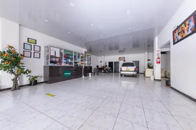 a large room with a car parked in it at Hotel Vegas Sergio in Medellín