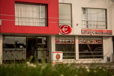 a store with a sign on the front of a building at Europa Hotel Boutique Manizales in Manizales