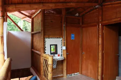 an inside view of a wooden house with a small window at hermosa cabaña villa majo, cuenta con el espectacular rio santo domingo in San Francisco